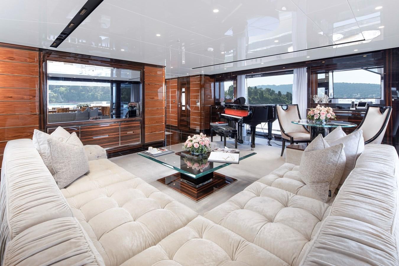 a living room with a large window aboard STERN Yacht for Sale