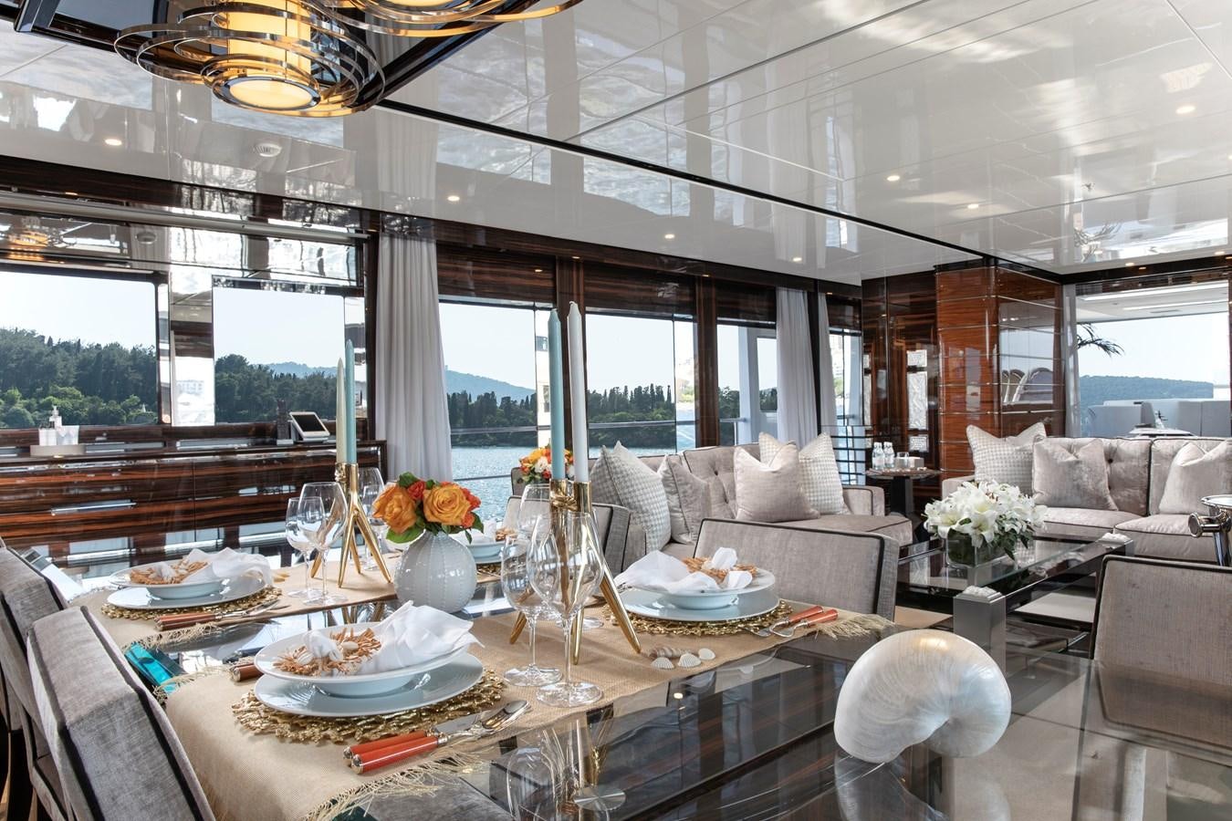 a large living room with a large window aboard STERN Yacht for Sale