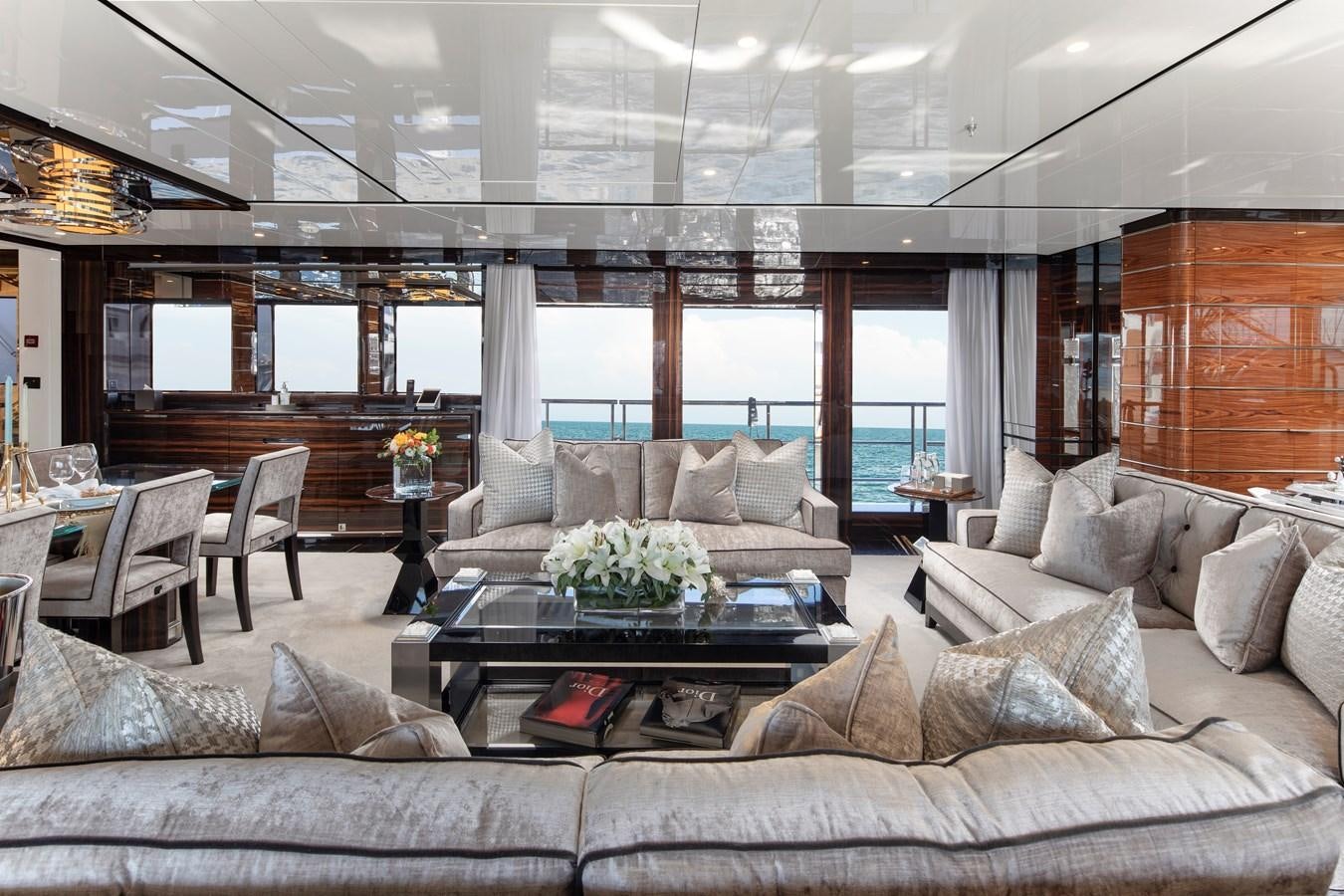 a living room with a large window aboard STERN Yacht for Sale
