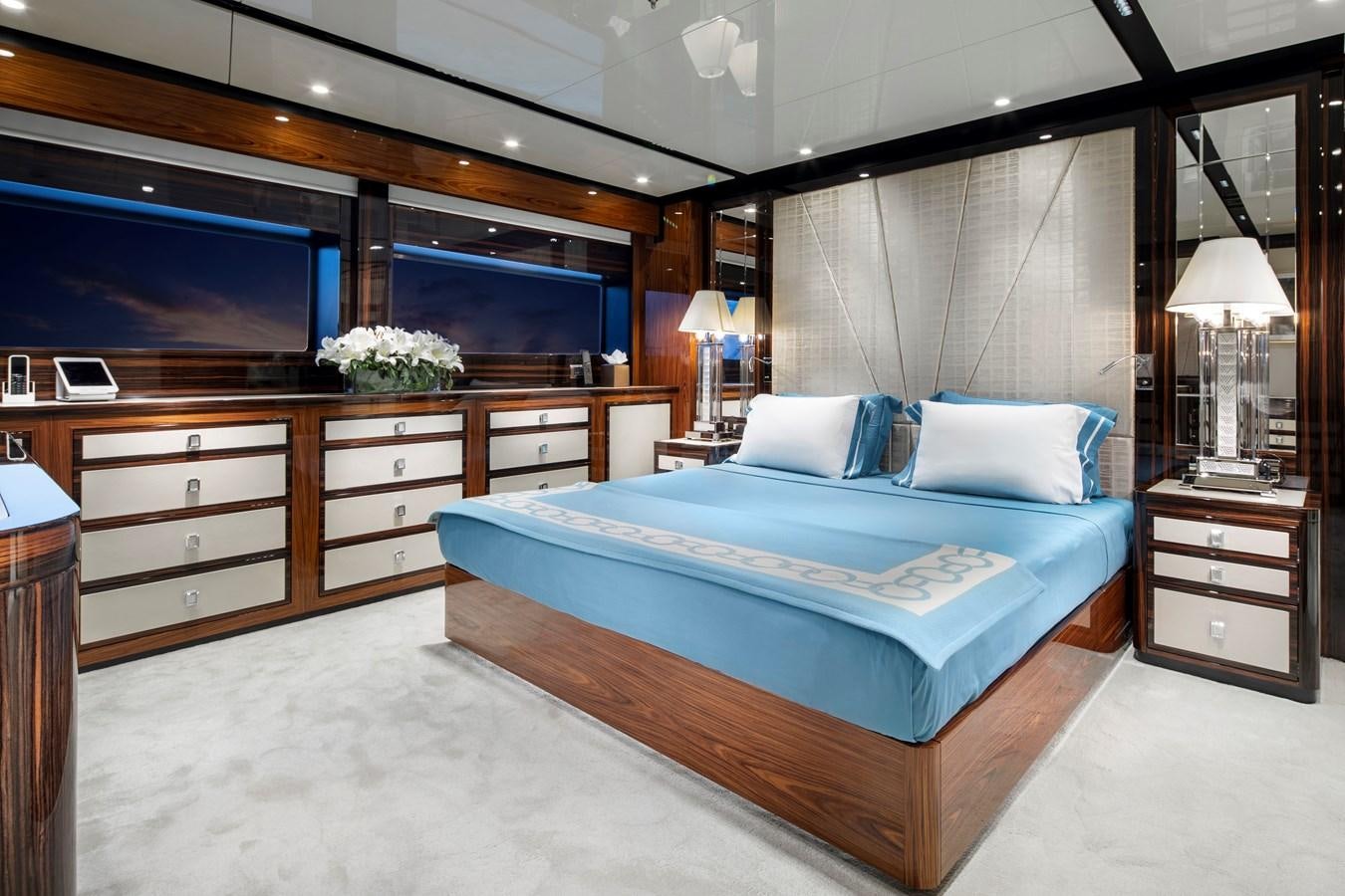 a bedroom with a bed and a tv aboard STERN Yacht for Sale