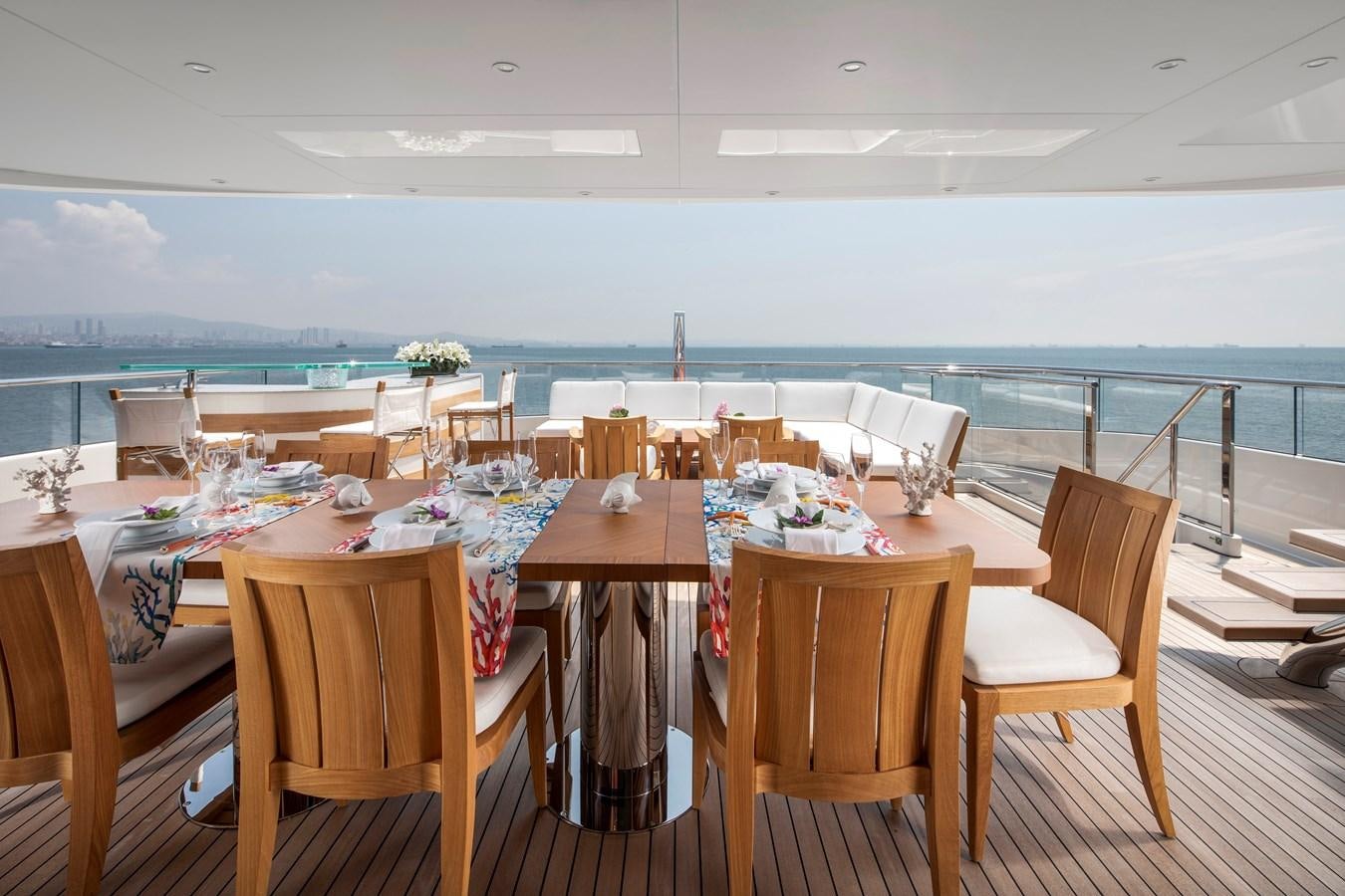 a table set for a dinner party aboard STERN Yacht for Sale