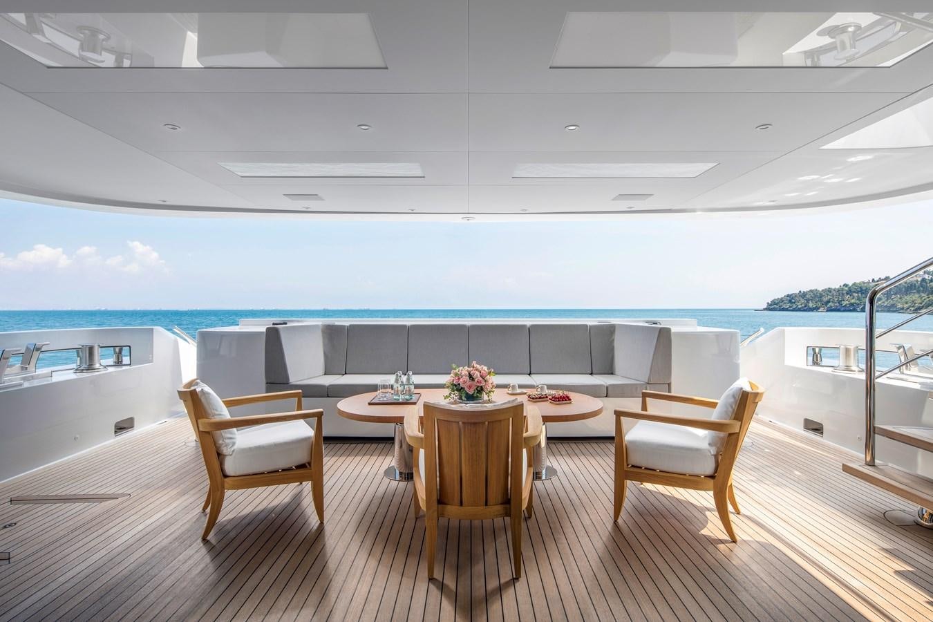 a room with a table and chairs aboard STERN Yacht for Sale