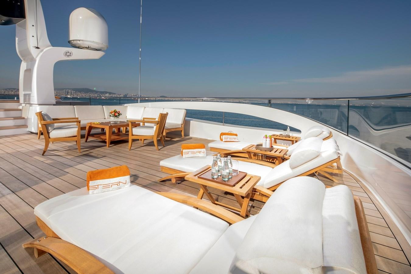 a room with a table and chairs on it aboard STERN Yacht for Sale
