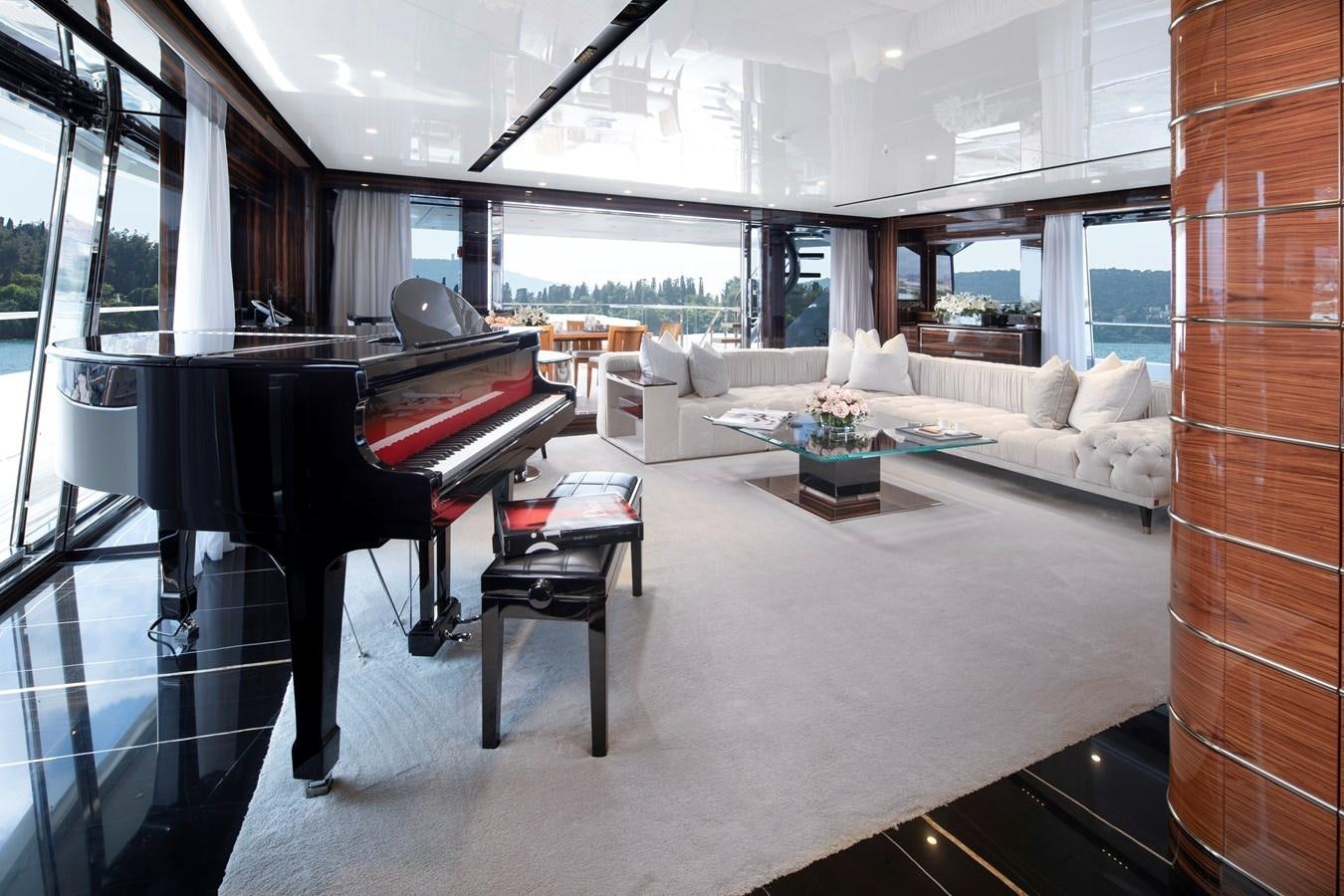 a piano in a room aboard STERN Yacht for Sale