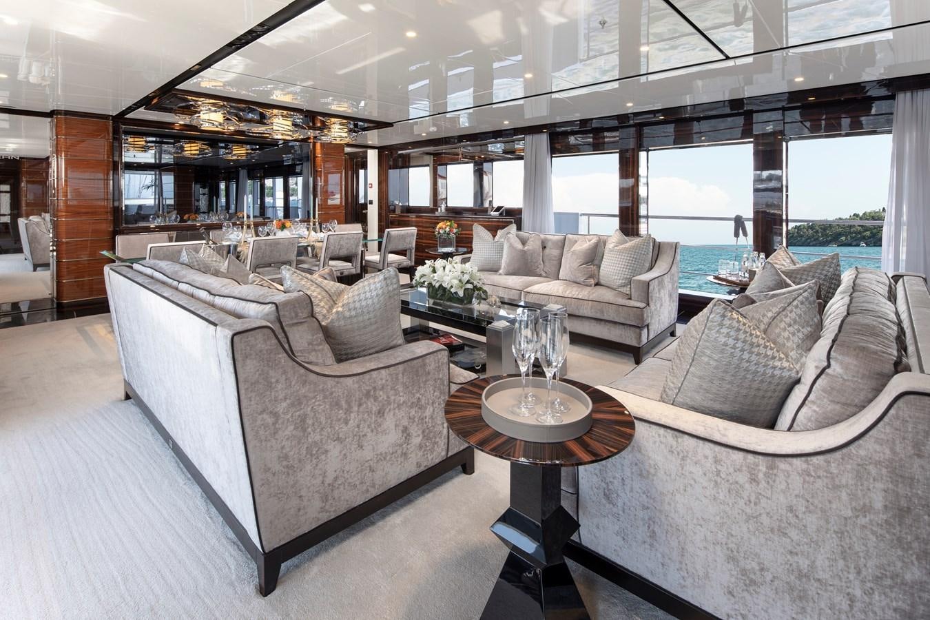 a living room with a large window aboard STERN Yacht for Sale