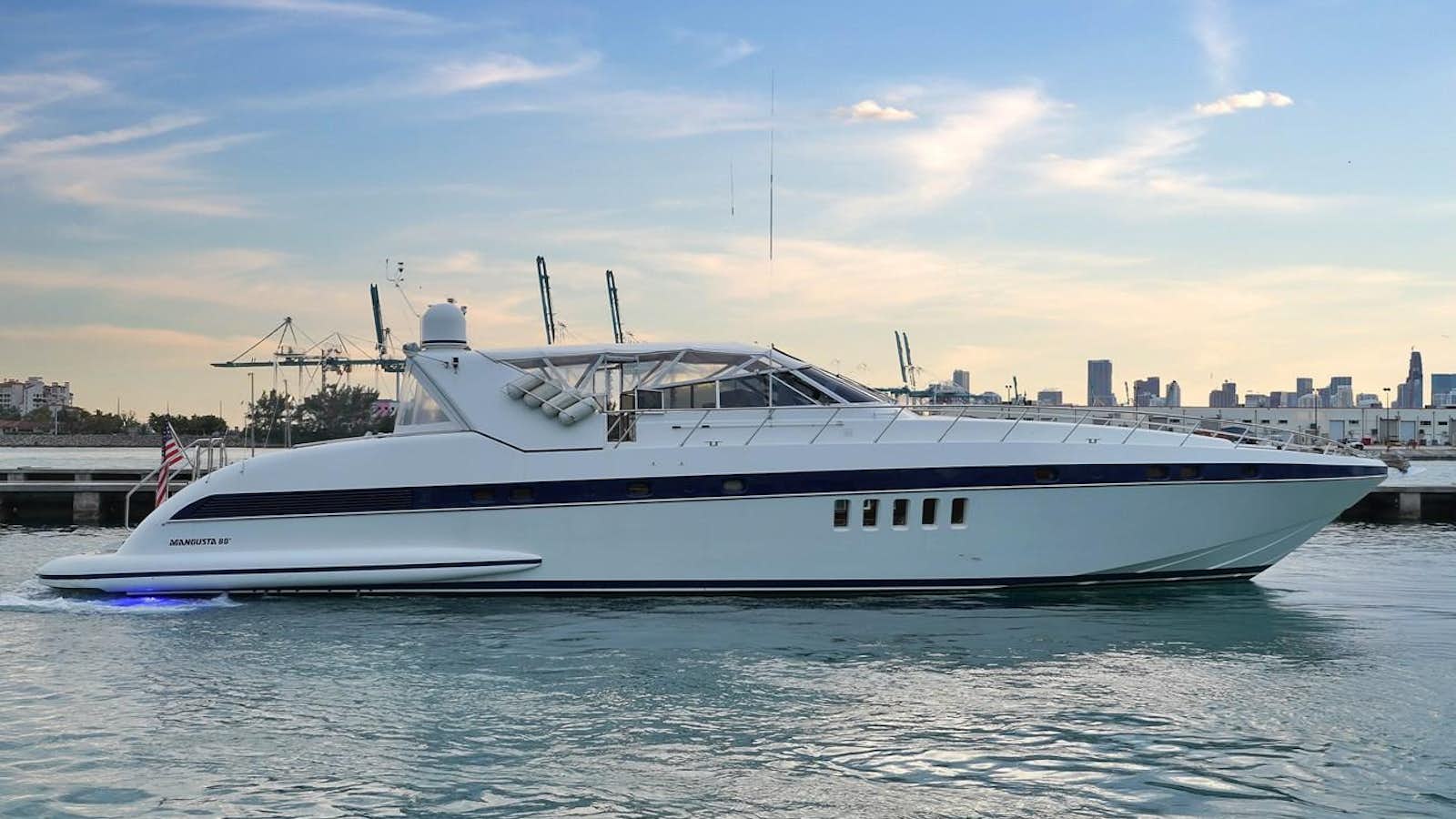 a white yacht on the water aboard HAKUNA MATATA Yacht for Sale