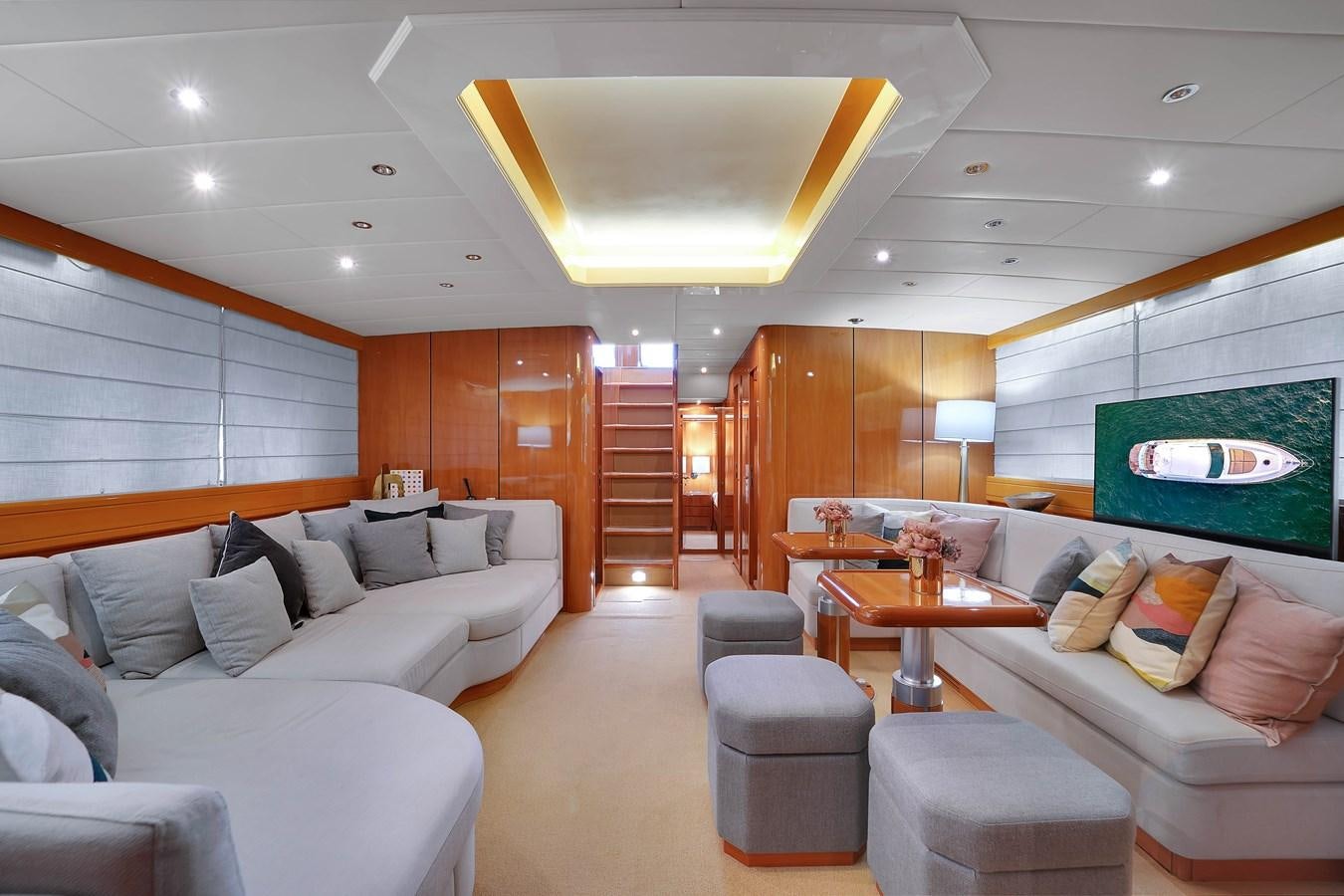 a living room with a large open door aboard HAKUNA MATATA Yacht for Sale