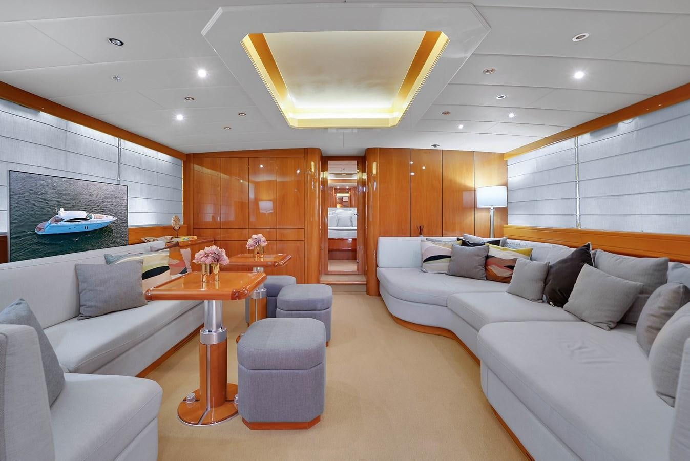 a living room with a large window aboard HAKUNA MATATA Yacht for Sale