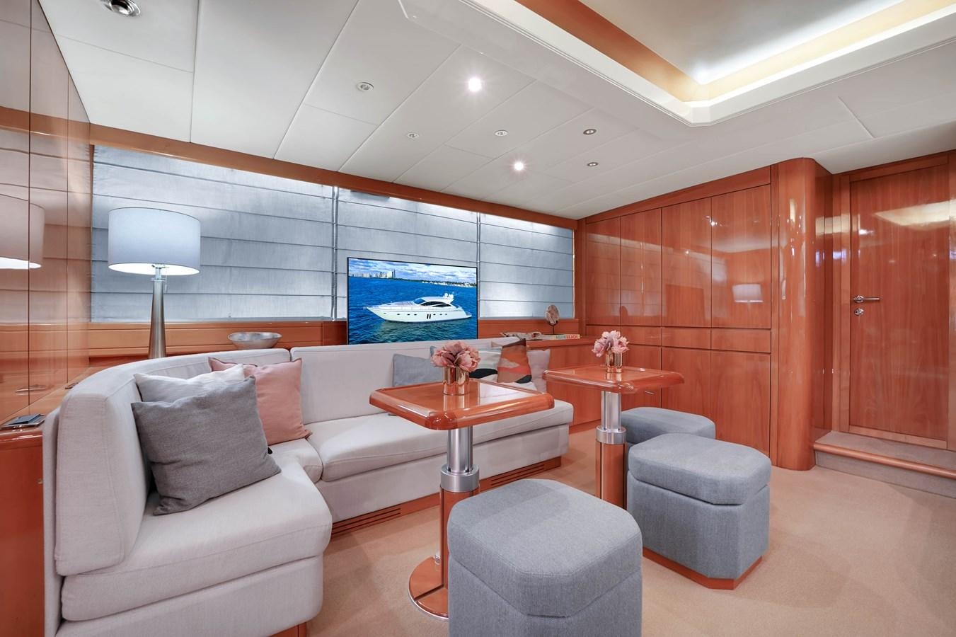 a room with a couch and a table aboard HAKUNA MATATA Yacht for Sale