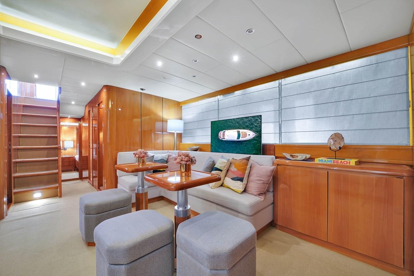 a room with a couch and a table aboard HAKUNA MATATA Yacht for Sale