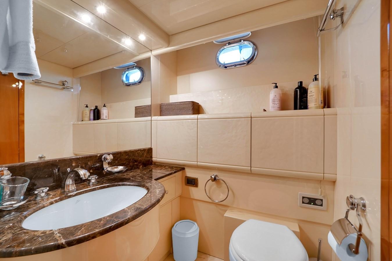 a bathroom with a sink and toilet aboard HAKUNA MATATA Yacht for Sale