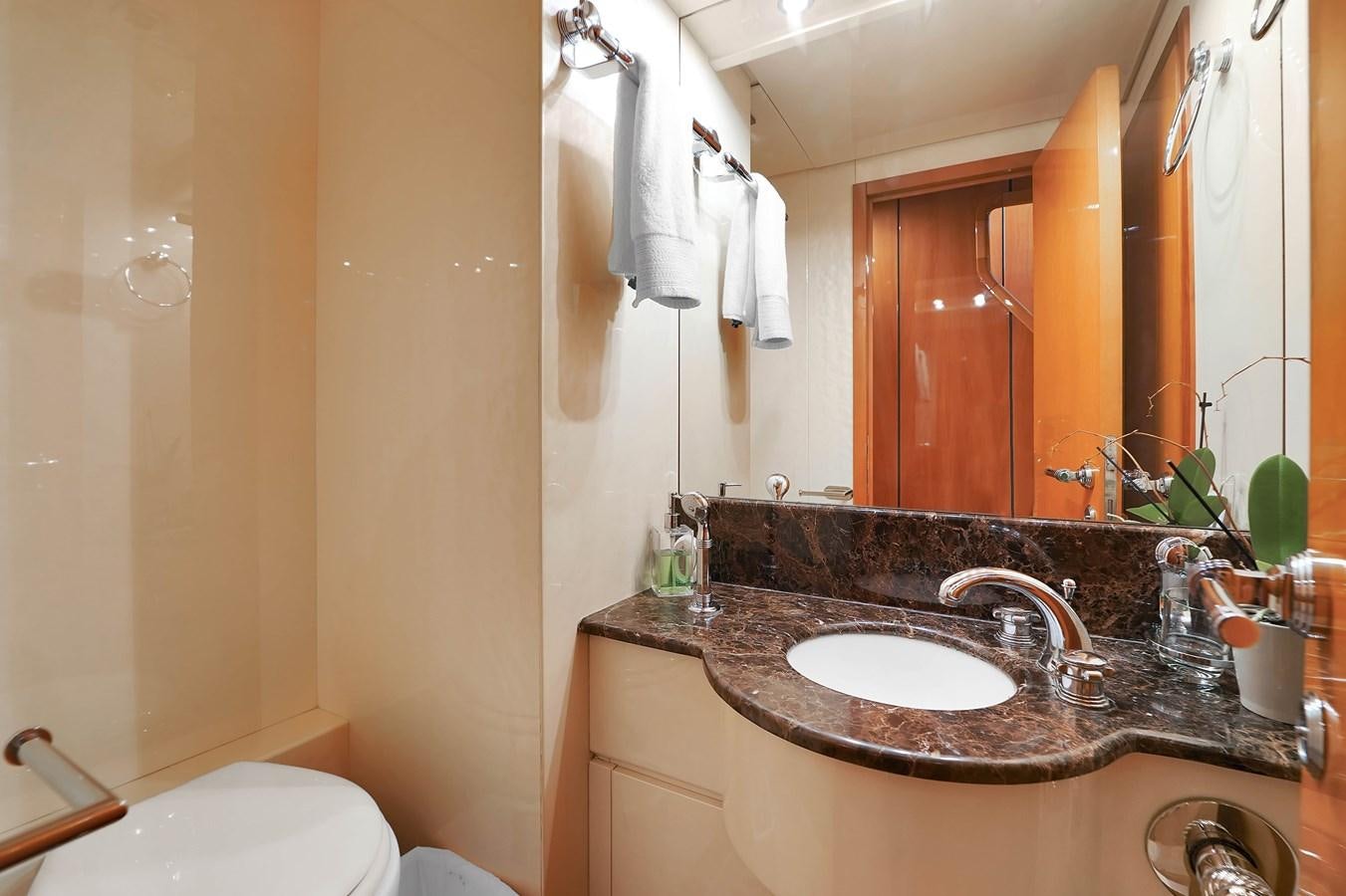 a bathroom with a sink and a mirror aboard HAKUNA MATATA Yacht for Sale