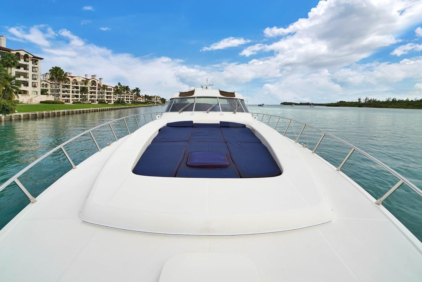 a boat on a body of water aboard HAKUNA MATATA Yacht for Sale