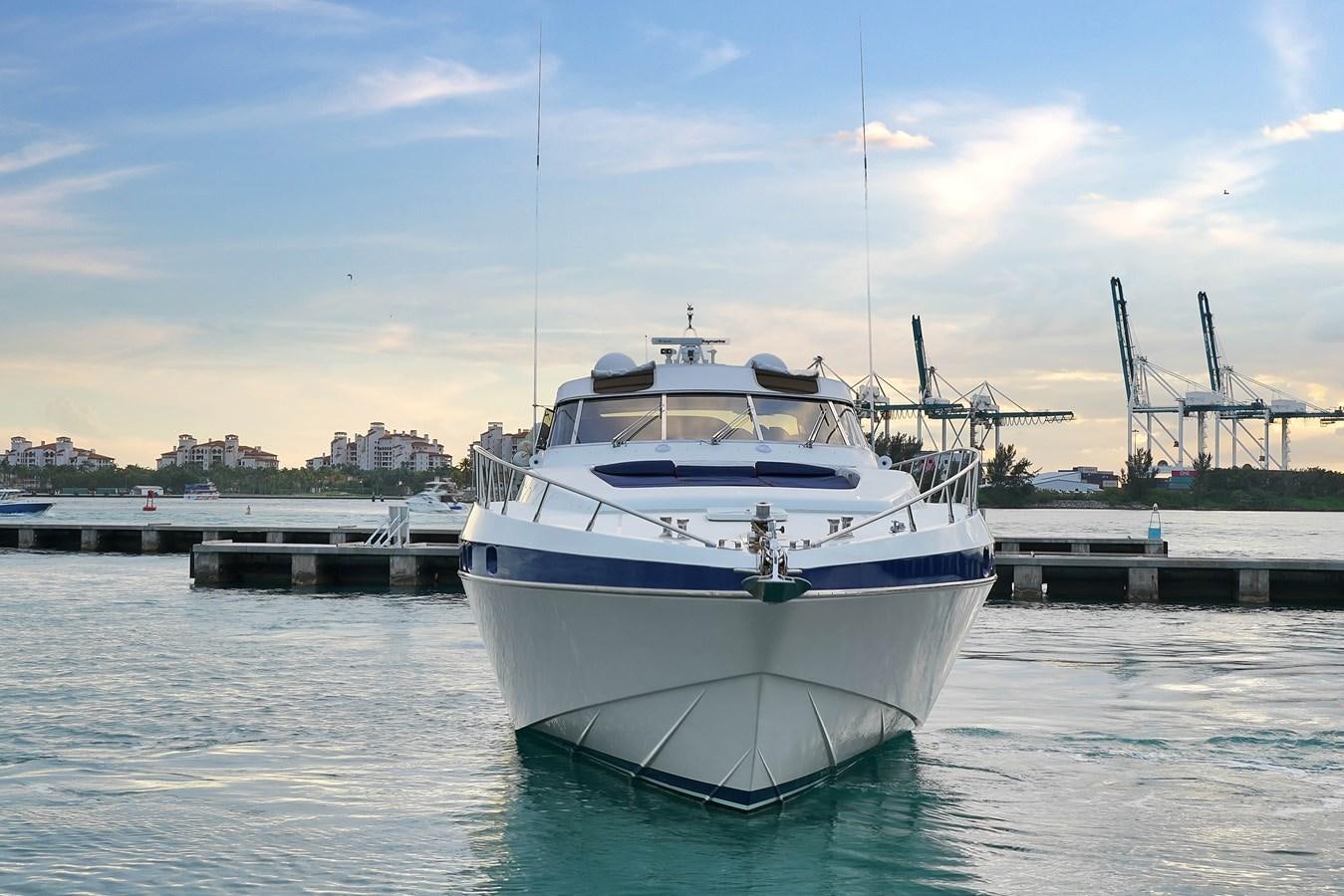 a boat docked at a pier aboard HAKUNA MATATA Yacht for Sale