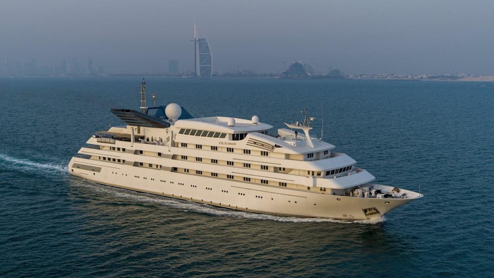 a large white ship in the water aboard DUBAWI Yacht for Sale