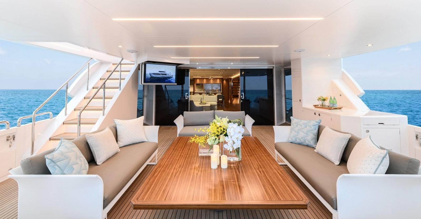 a living room with a large balcony aboard CHRISTINE Yacht for Sale