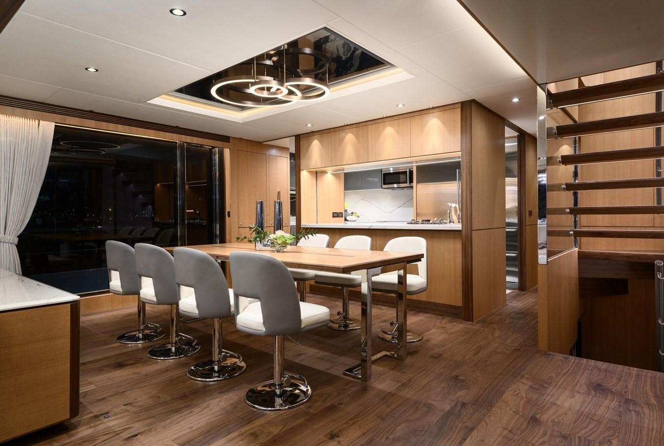 a room with a table and chairs aboard CHRISTINE Yacht for Sale