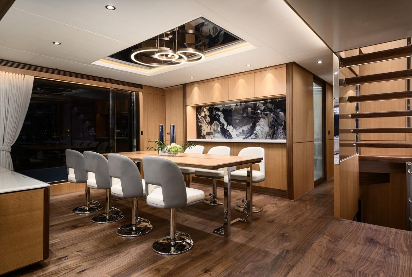 a room with a table and chairs aboard CHRISTINE Yacht for Sale