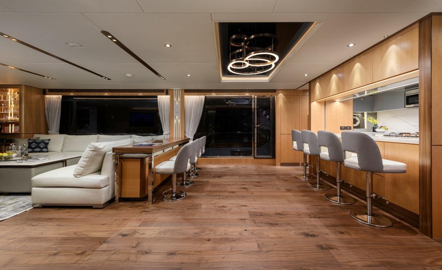 a living room with a wood floor aboard CHRISTINE Yacht for Sale