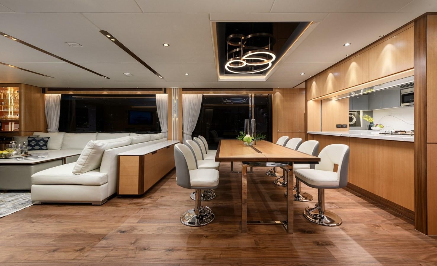 a living room with a table and chairs aboard CHRISTINE Yacht for Sale