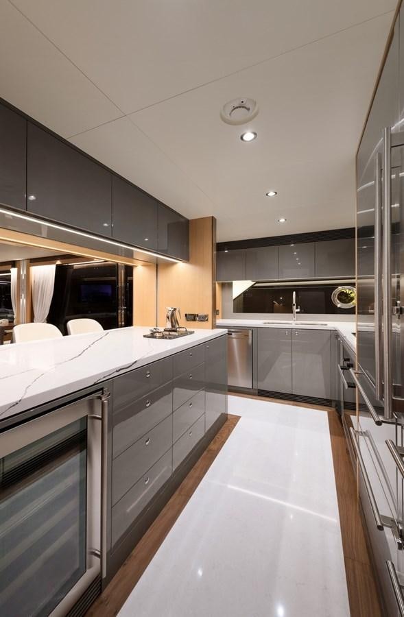 a kitchen with a large island aboard CHRISTINE Yacht for Sale