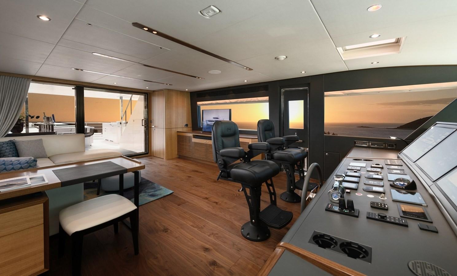 a room with a table and chairs aboard CHRISTINE Yacht for Sale