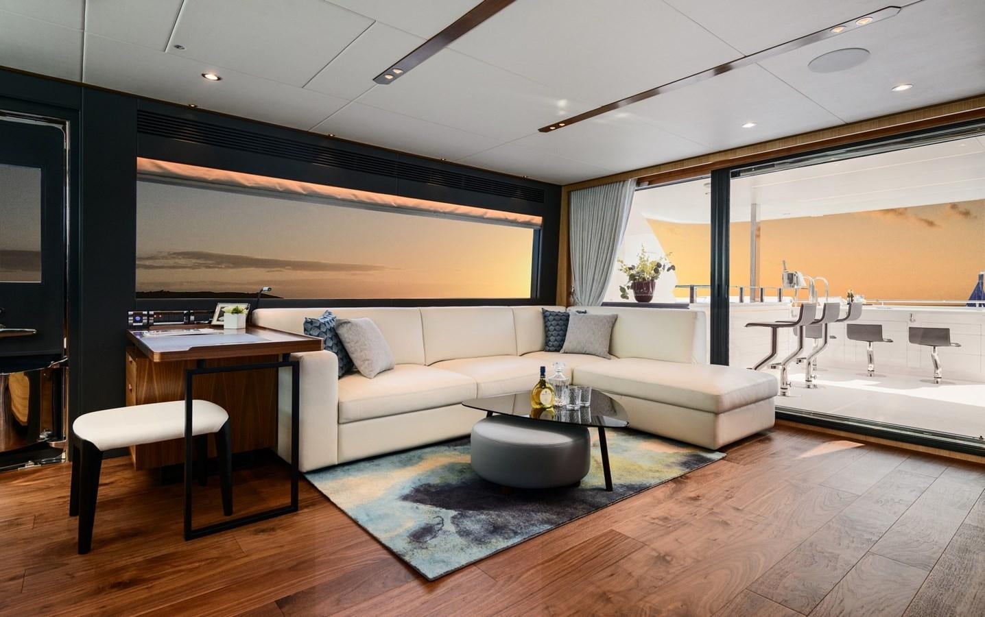 a living room with a couch and a table aboard CHRISTINE Yacht for Sale