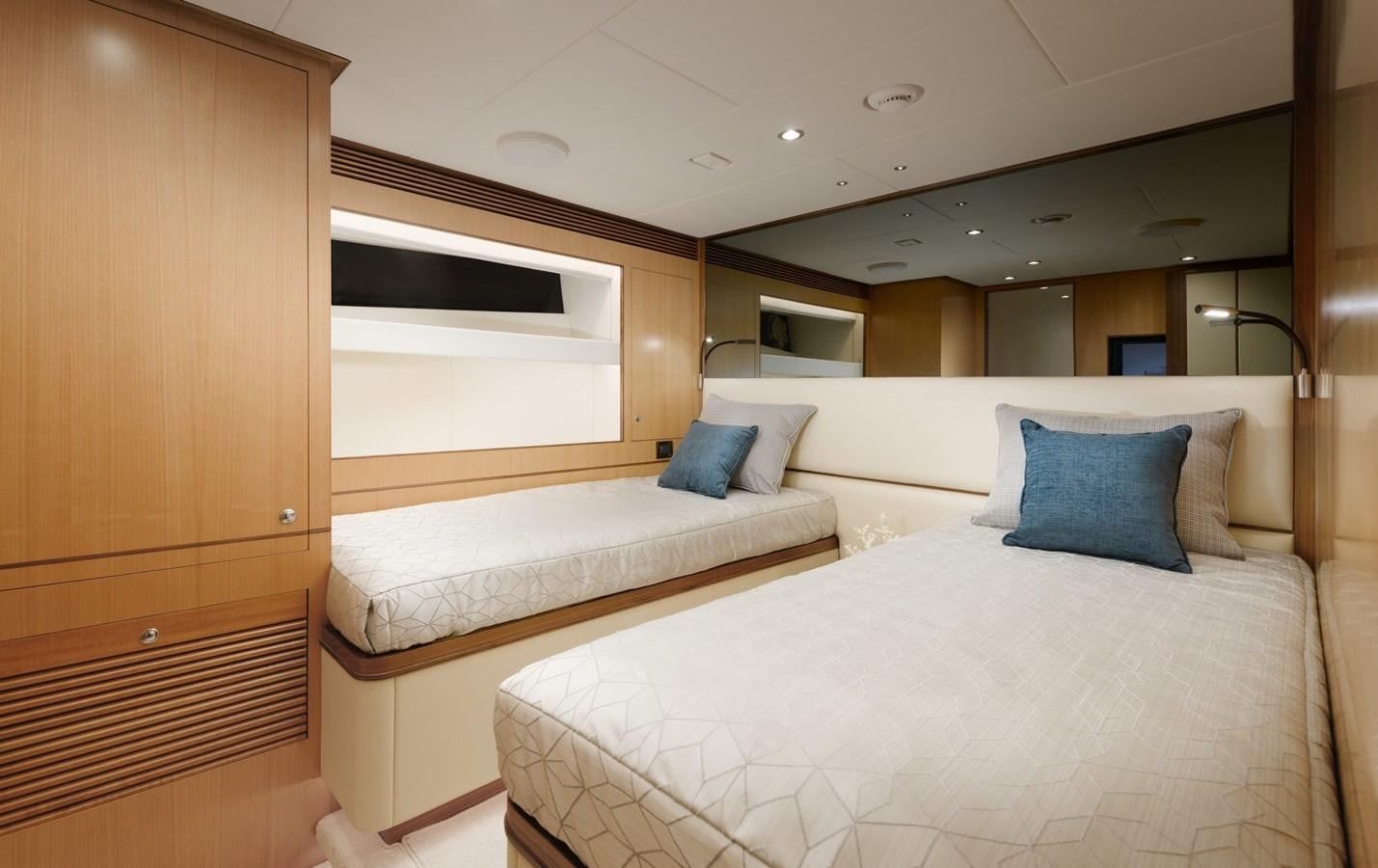 a room with a bed and a television aboard CHRISTINE Yacht for Sale