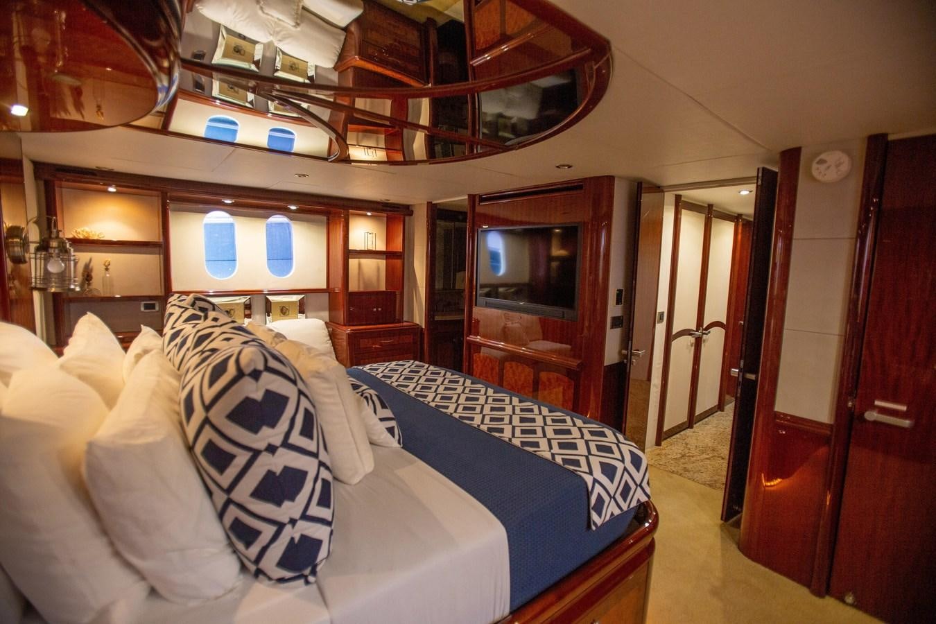 a bed in a room aboard LAZZARA 80' Yacht for Sale