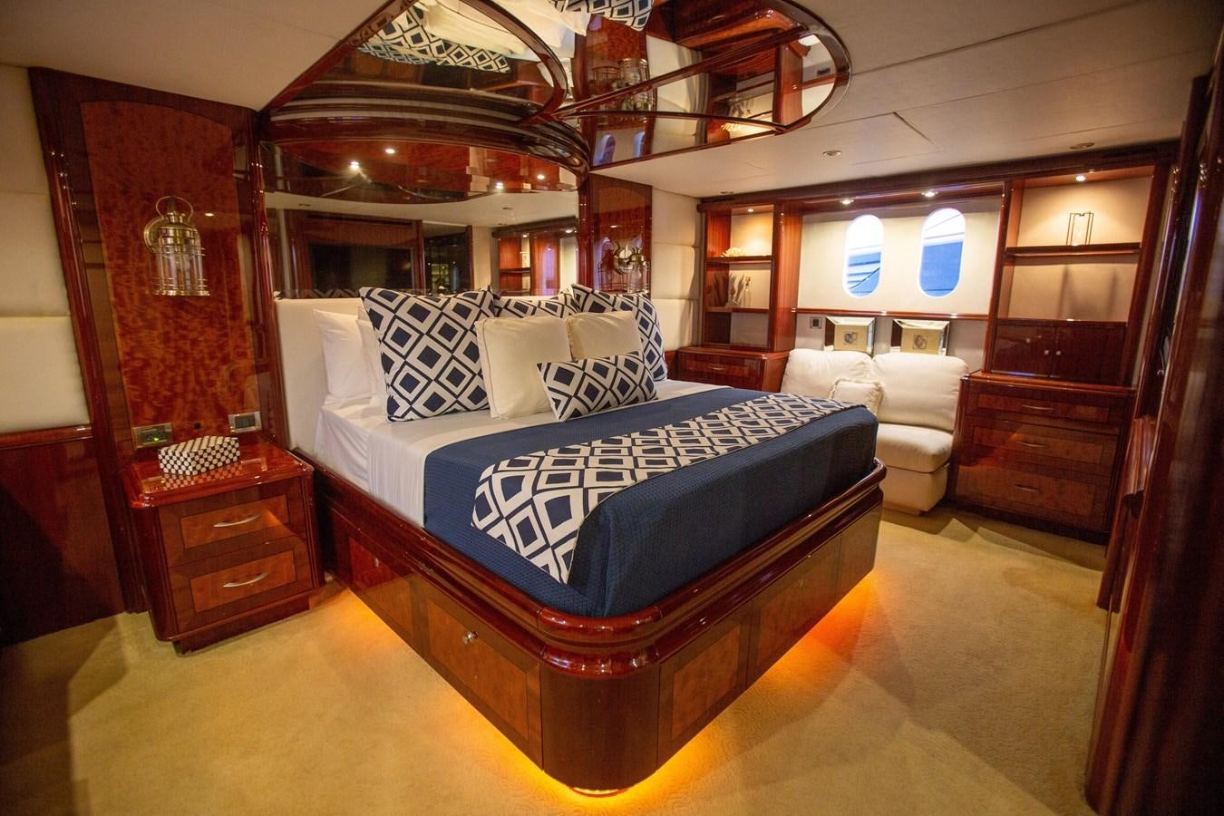 a bed in a room aboard LAZZARA 80' Yacht for Sale
