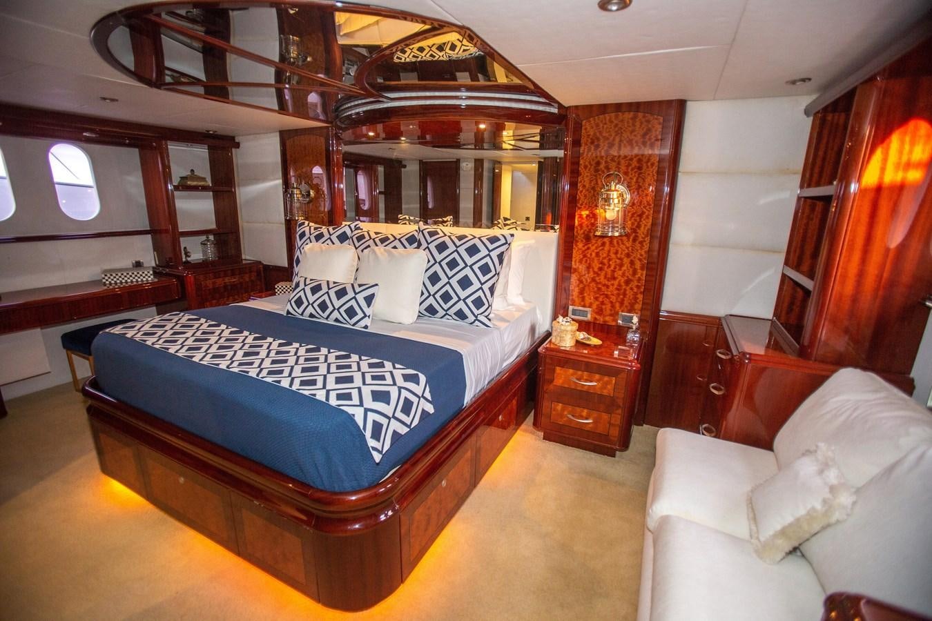 a bed in a room aboard LAZZARA 80' Yacht for Sale