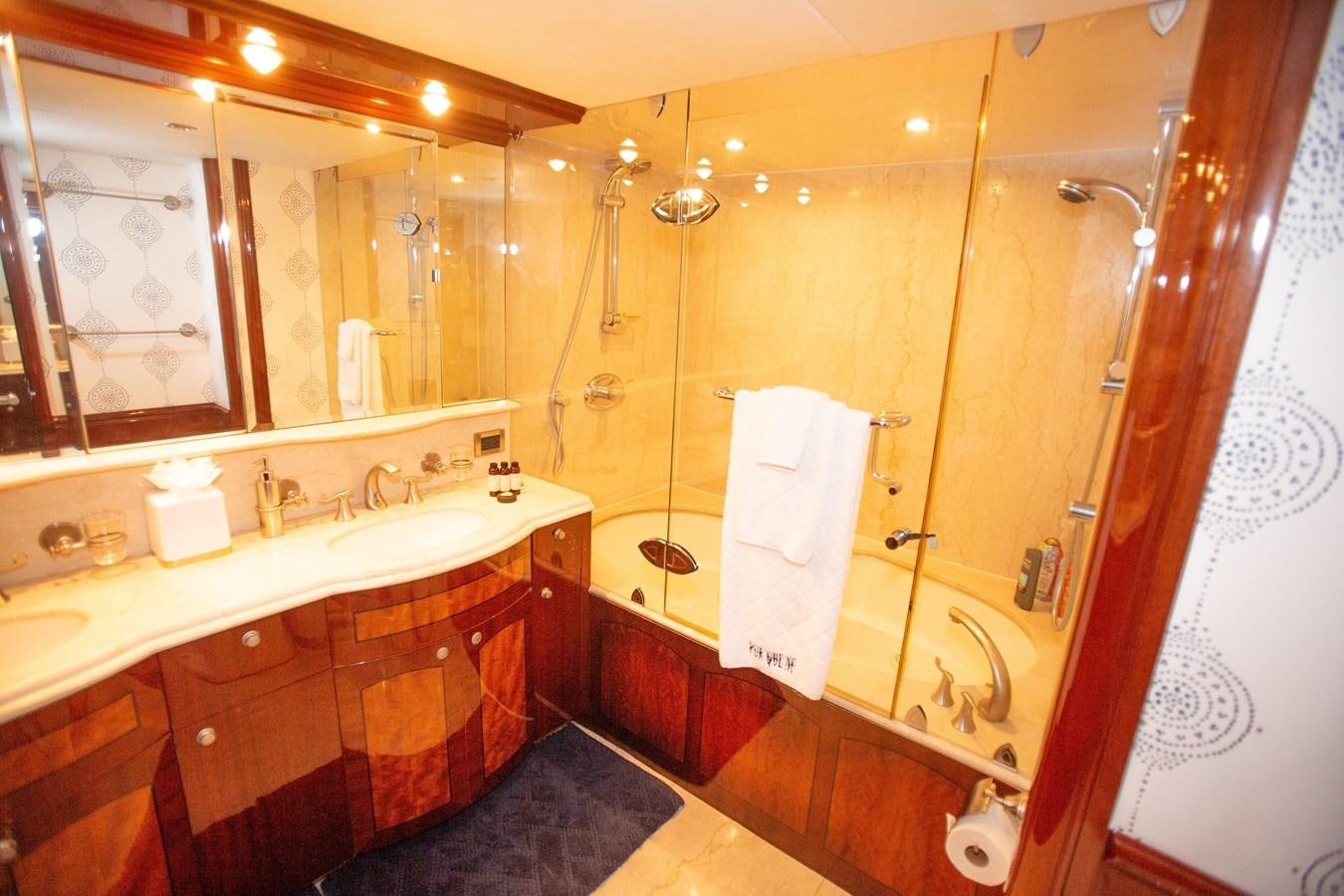 a bathroom with a large mirror aboard LAZZARA 80' Yacht for Sale