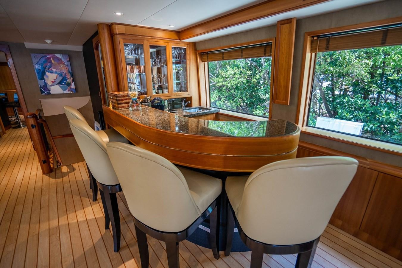 a kitchen with a table and chairs aboard SHORT GAME Yacht for Sale