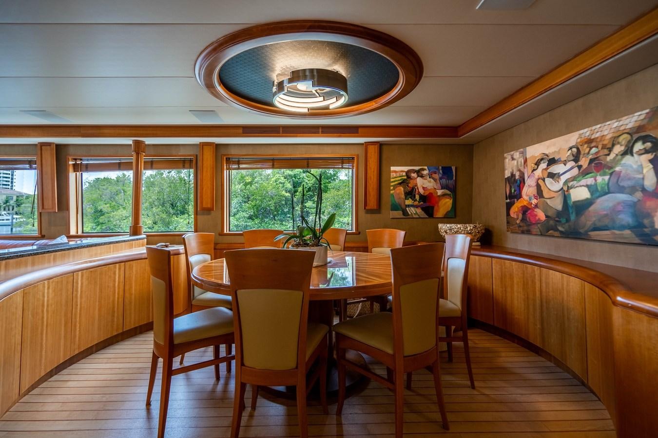 a dining room with a table and chairs aboard SHORT GAME Yacht for Sale