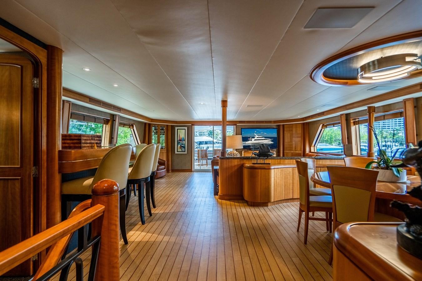 a room with tables and chairs aboard SHORT GAME Yacht for Sale