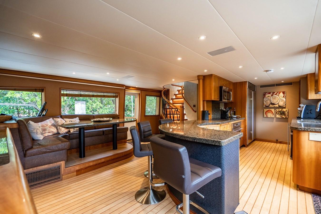 a living room with a large island aboard SHORT GAME Yacht for Sale