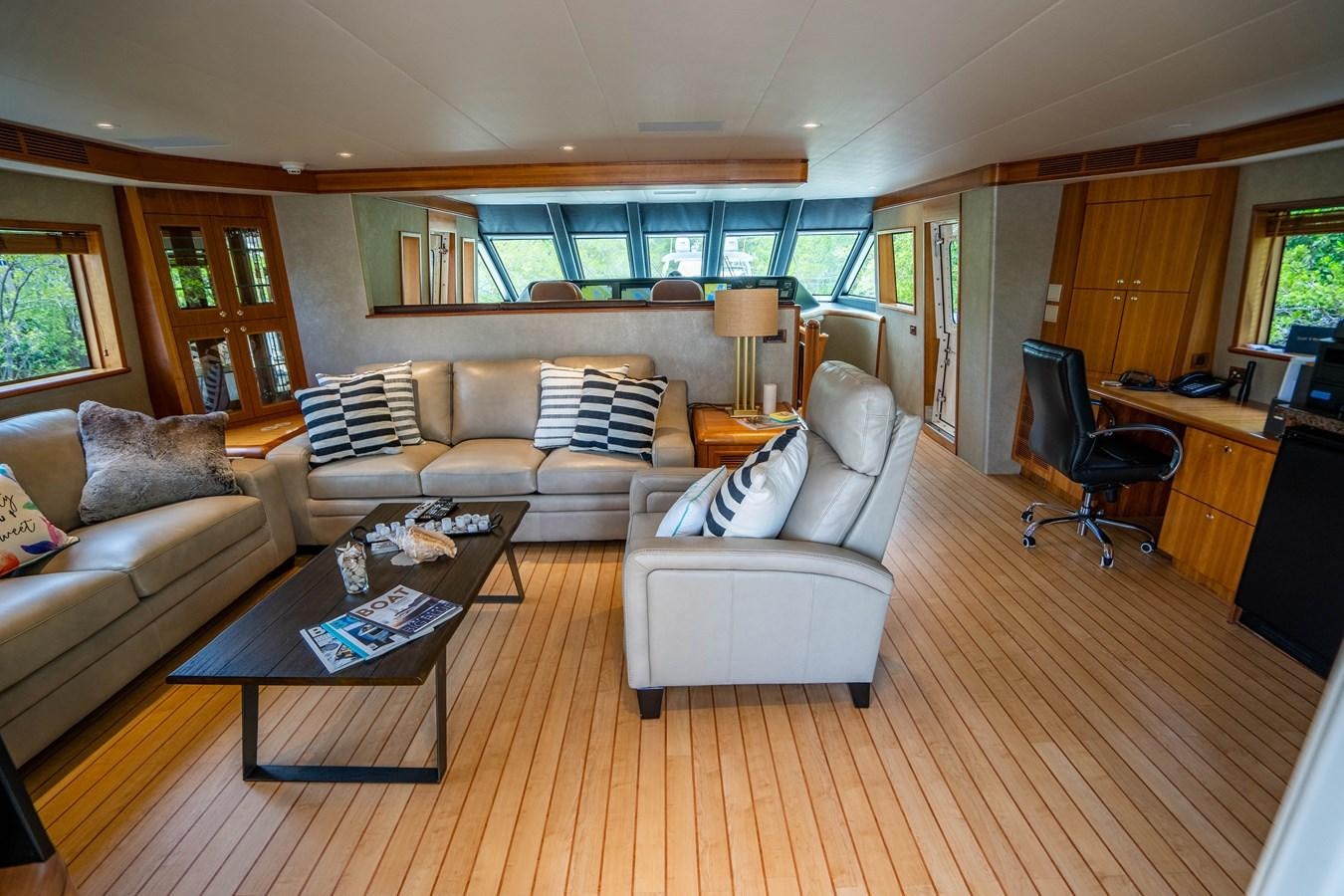 a living room with a couch and a coffee table aboard SHORT GAME Yacht for Sale