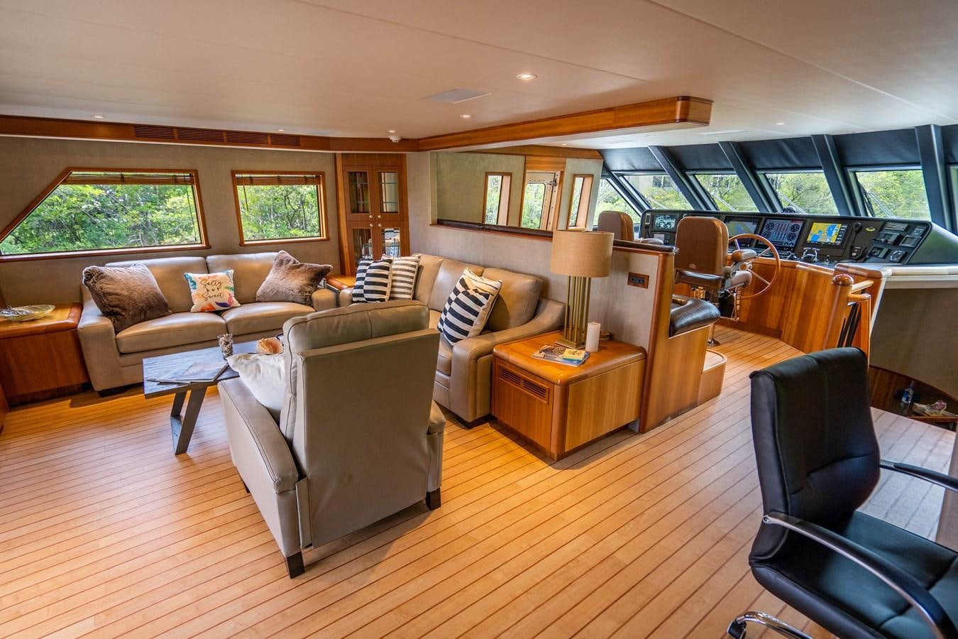 a living room with a couch and a table aboard SHORT GAME Yacht for Sale