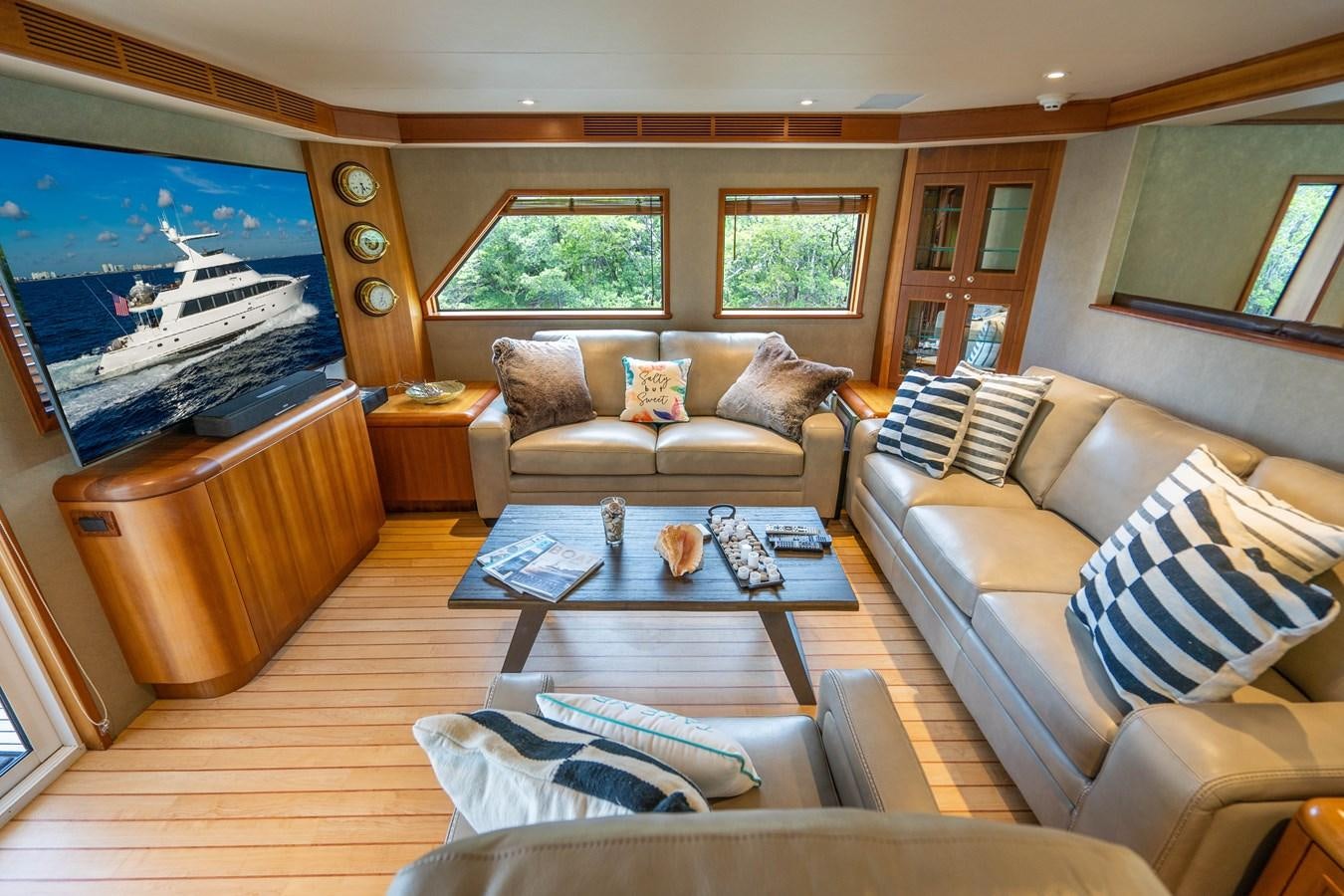 a living room with a large screen aboard SHORT GAME Yacht for Sale