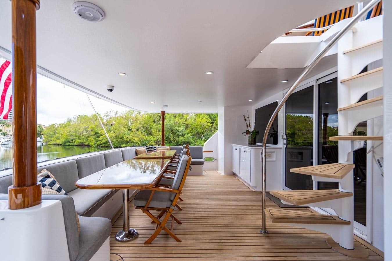 a living room with a table and chairs aboard SHORT GAME Yacht for Sale