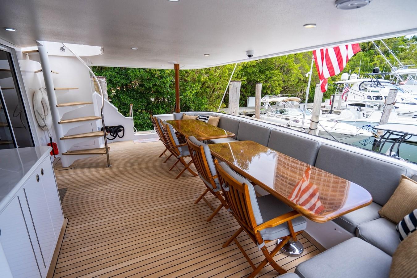 a deck with chairs and tables aboard SHORT GAME Yacht for Sale