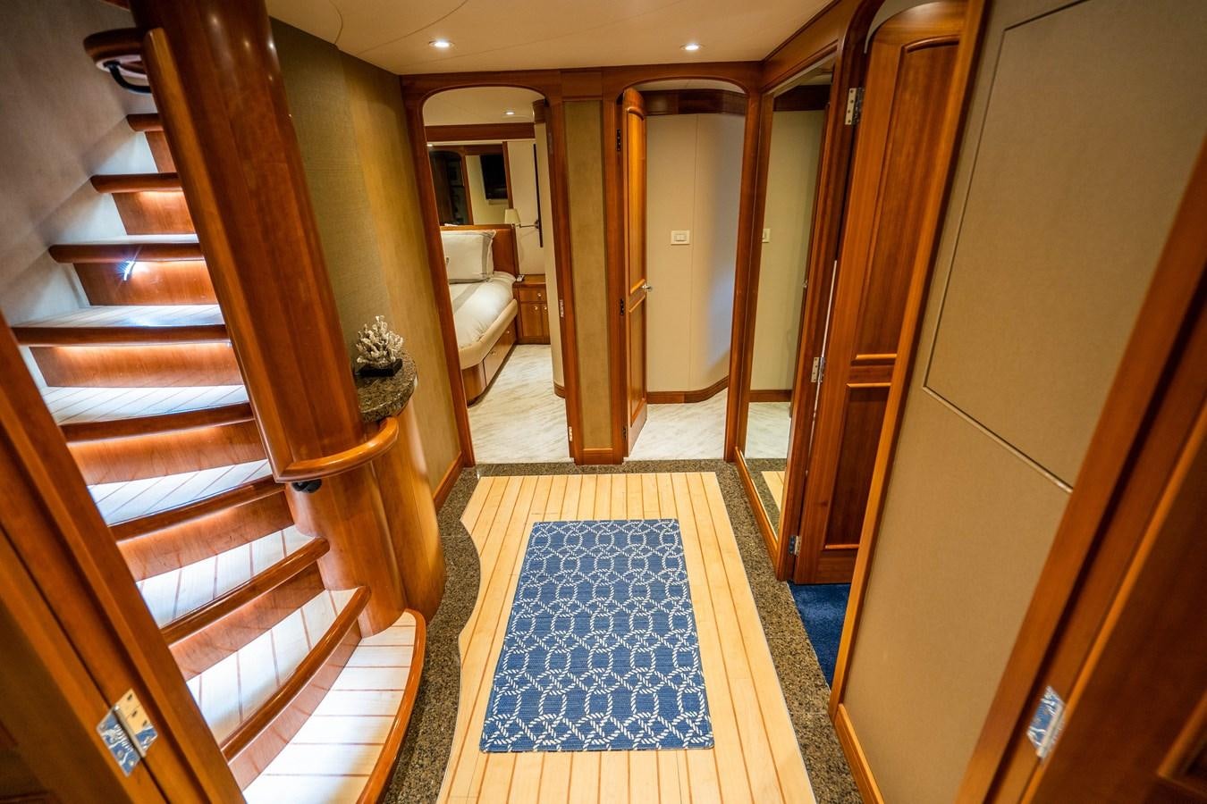 a hallway with a blue rug aboard SHORT GAME Yacht for Sale