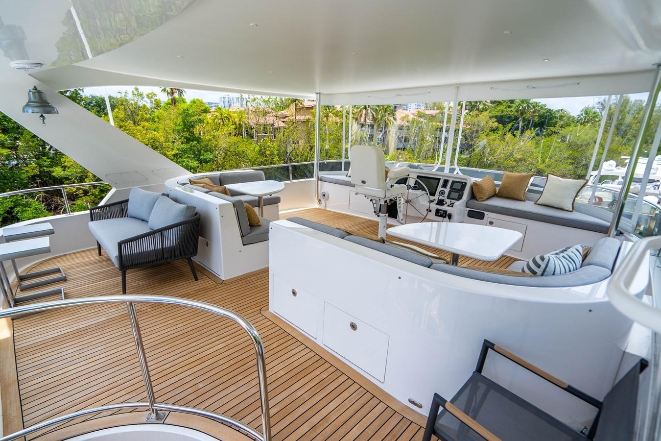 a large white kitchen with a large white table and chairs aboard SHORT GAME Yacht for Sale