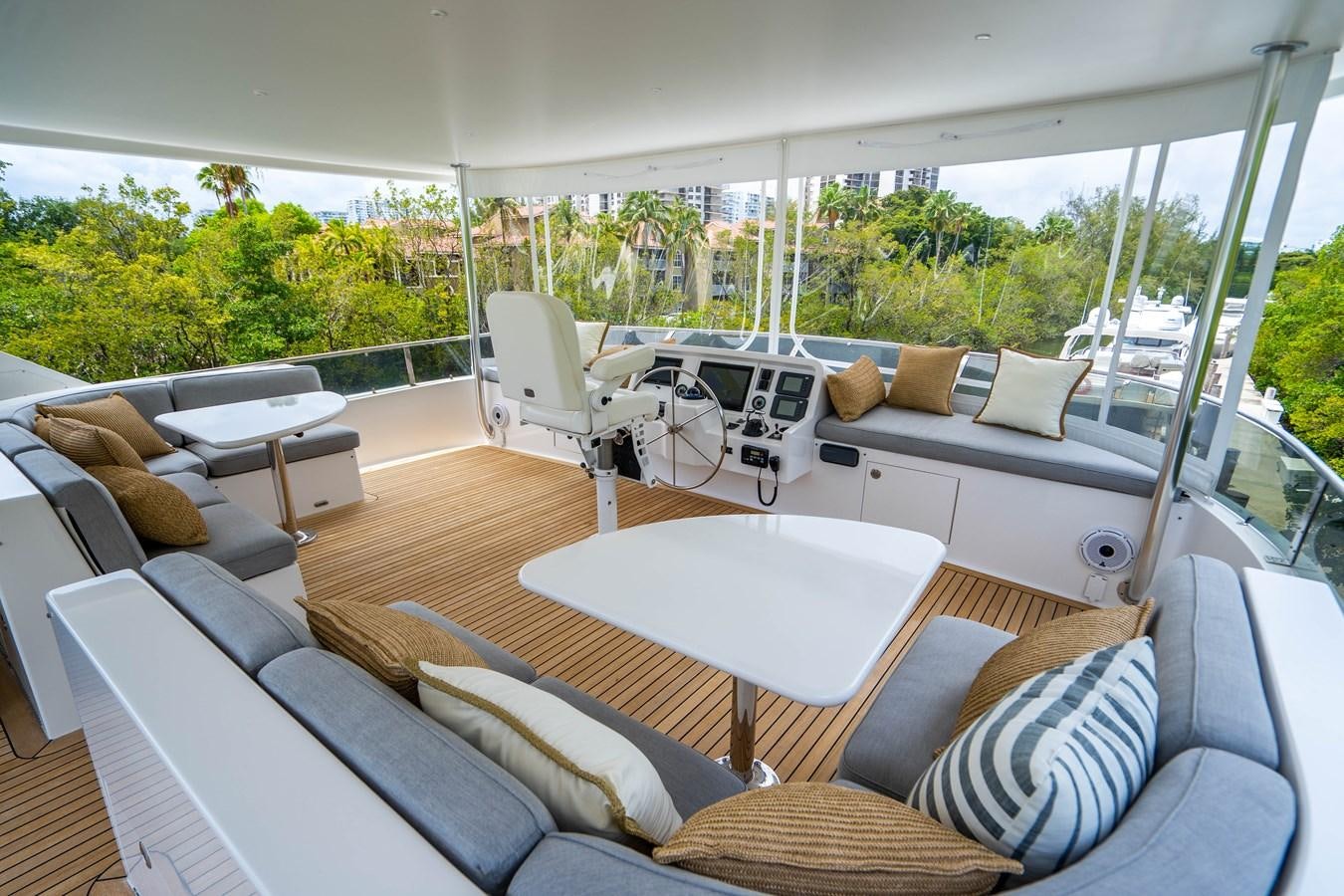 a living room with a large glass window aboard SHORT GAME Yacht for Sale