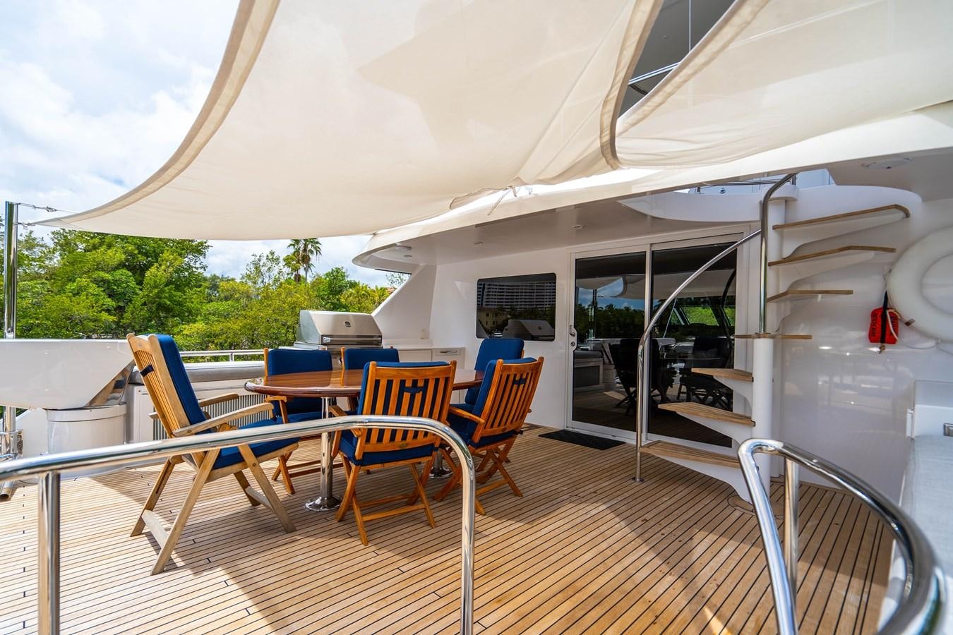 a room with a table and chairs aboard SHORT GAME Yacht for Sale