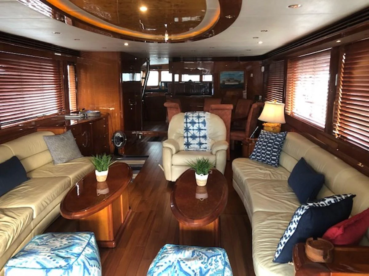 a living room with a couch and a coffee table aboard JEF82110L506 Yacht for Sale