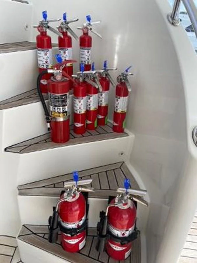 a shelf with bottles and cans on it aboard JEF82110L506 Yacht for Sale