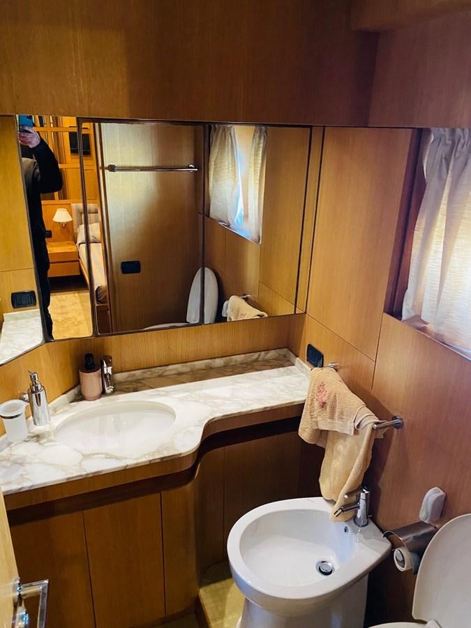 a bathroom with a mirror and a sink aboard DEA Yacht for Sale