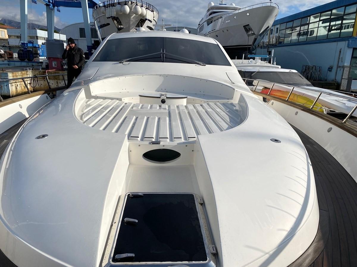 a white car with a black hood aboard DEA Yacht for Sale