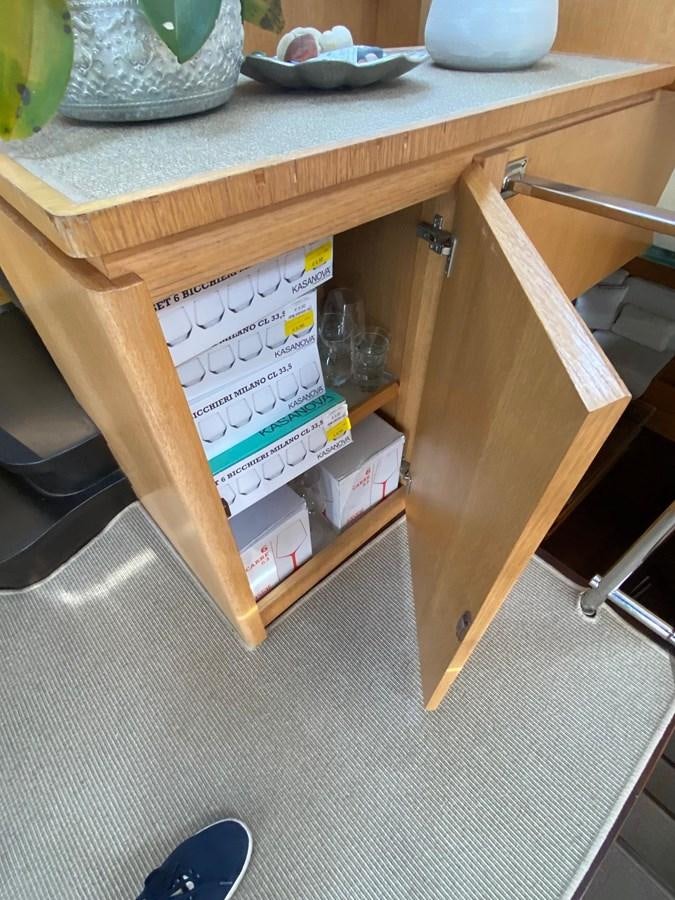 a wooden shelf with a box of tissues on it aboard DEA Yacht for Sale